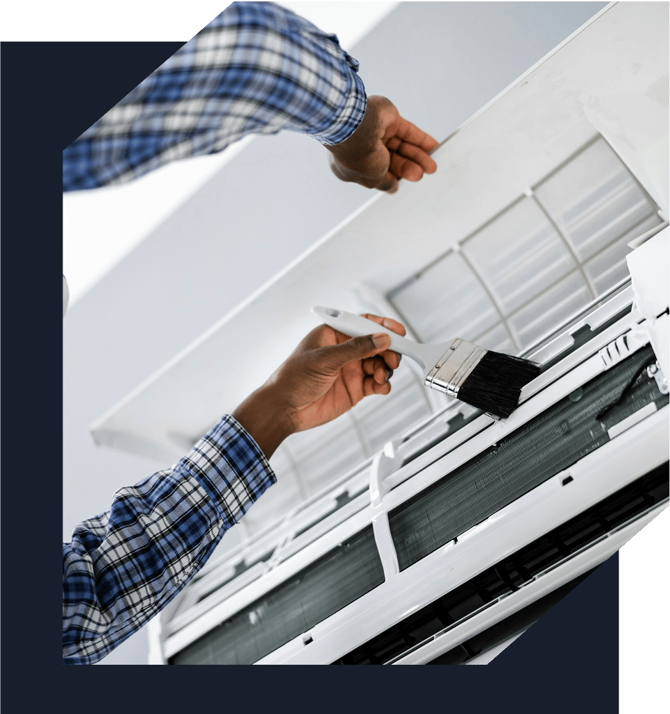 Man cleaning an air conditioner