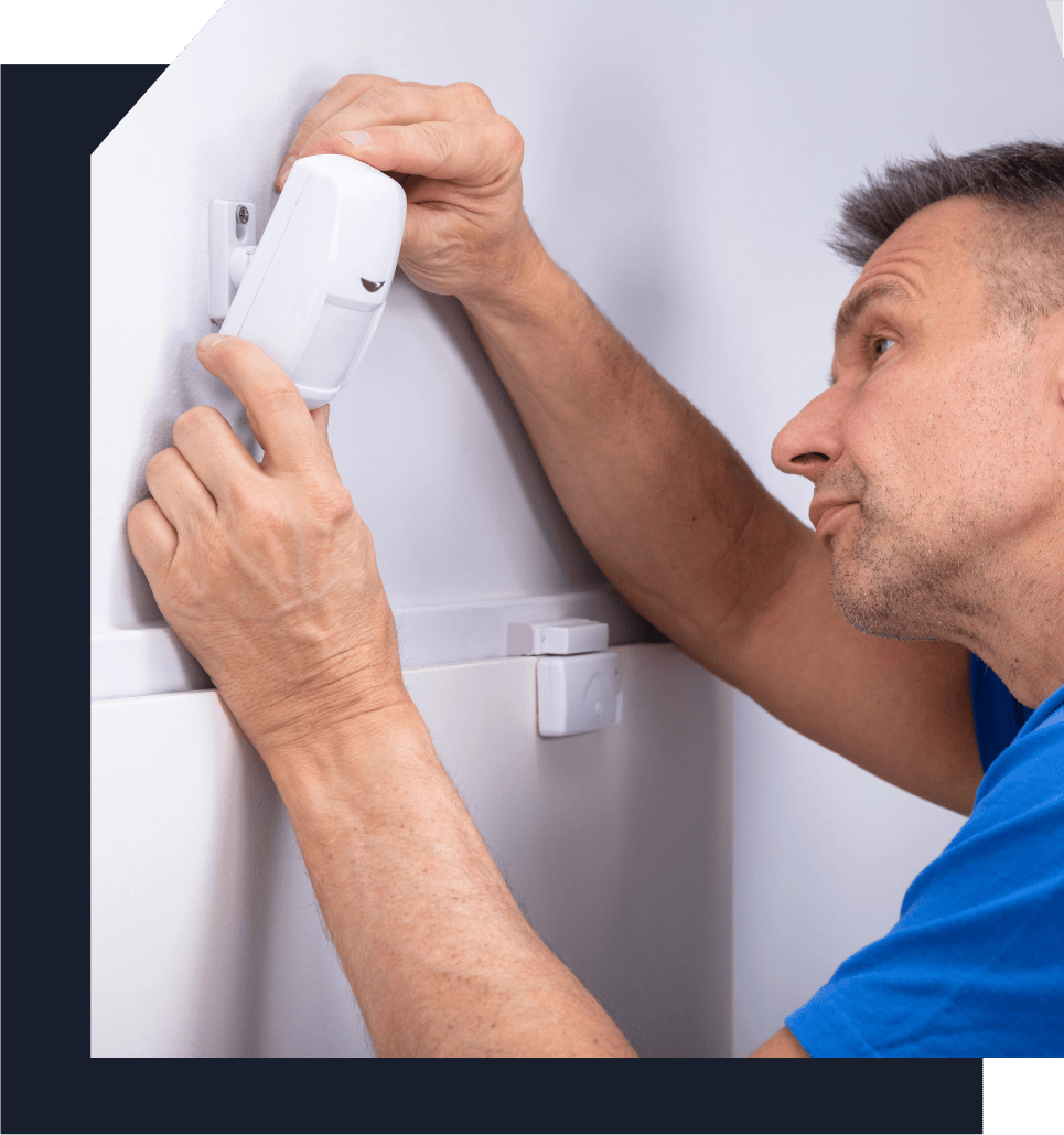 technician setting up home security device