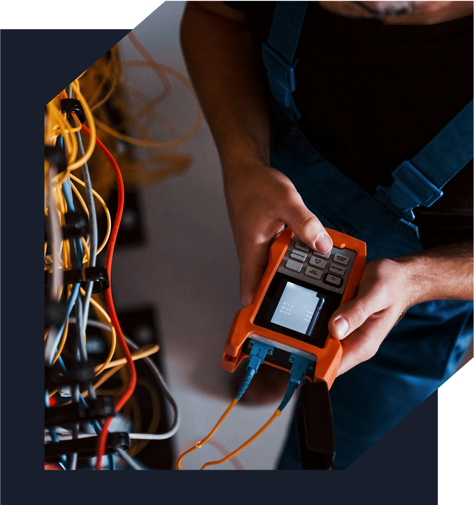 Electrician using a voltage tester on wires