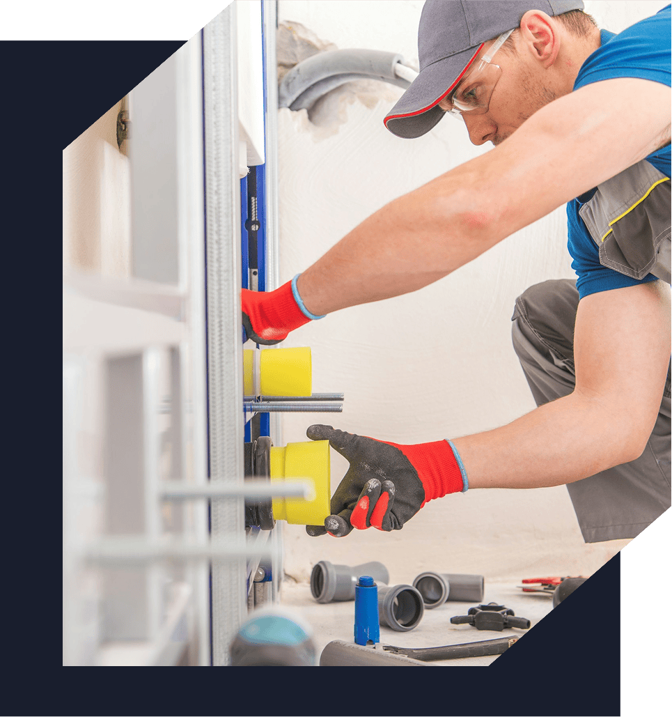 Plumber fixing pipes