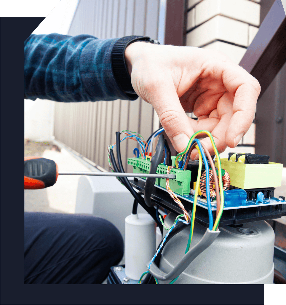 technician fixing wires from an automatic garage door